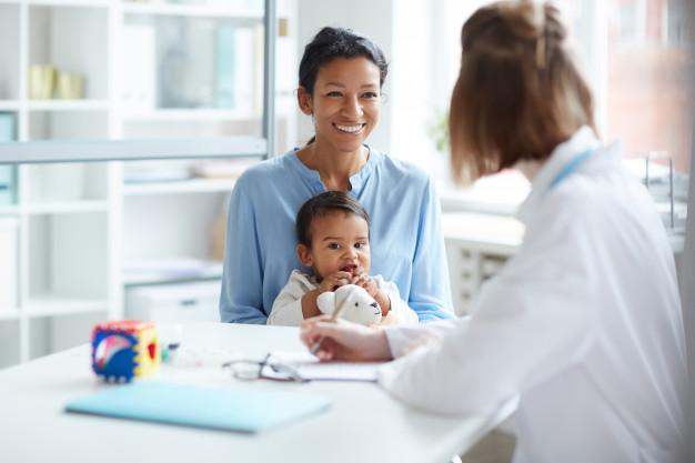 Mother with child at the doctor