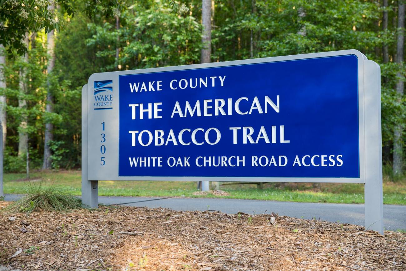 A photo of the sign located at the White Oak Church Road parking area on the American Tobacco Trail