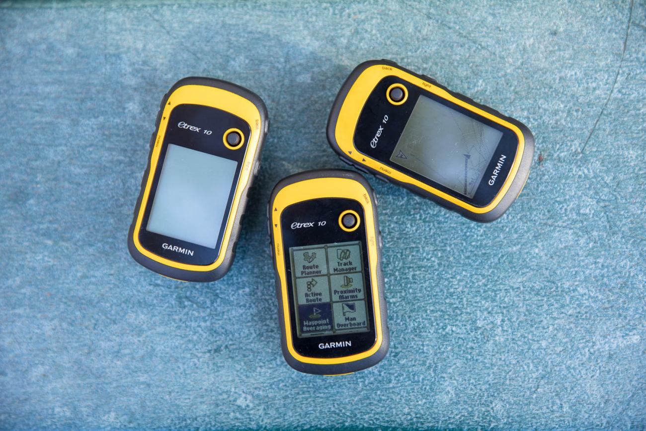 Photo of three GPS units used to locate geocaches during a "Geocaching 101" family program