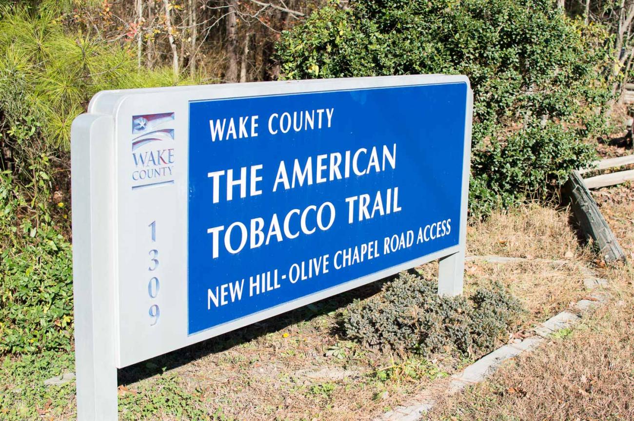 A photo of the New Hill-Olive Chapel parking area on the American Tobacco Trail