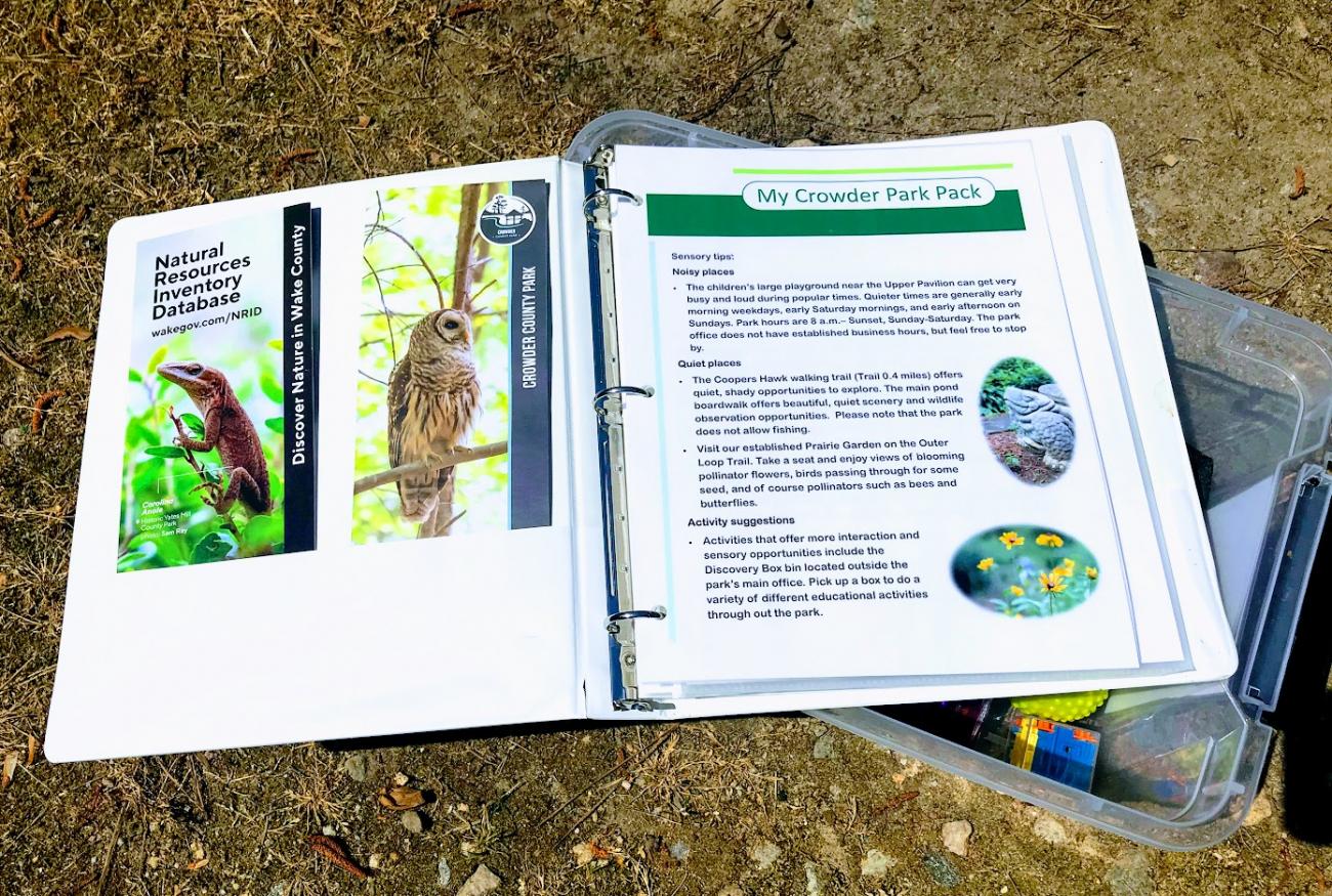 image of binder with resources such as brochures and schedules