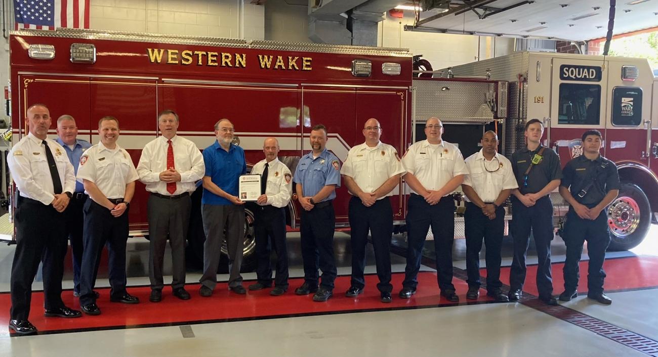 Insurance Commissioner Mike Causey and Western Wake FD squad members inside the station