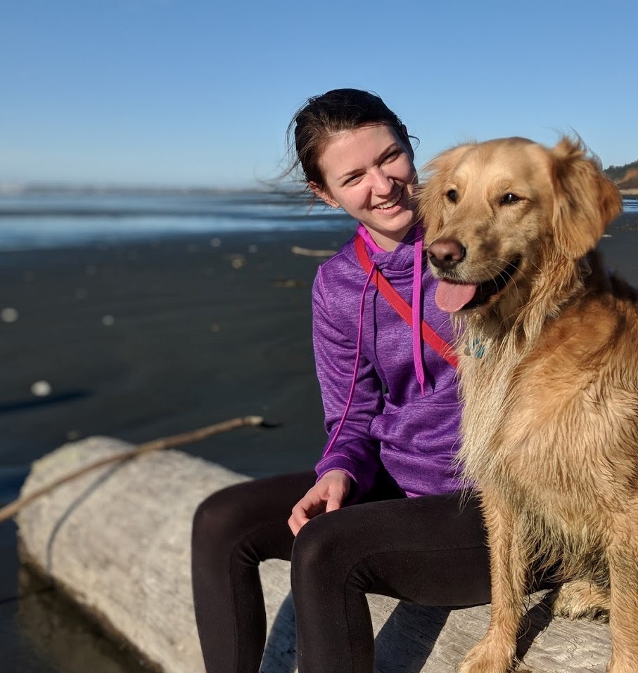 Courtney with her dog at the beach.