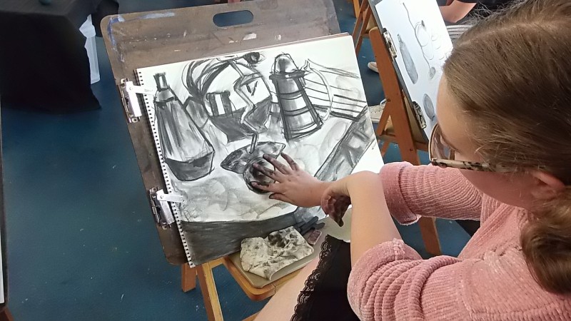 student working on drawing