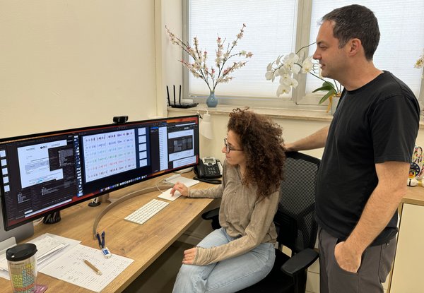 Graduate student Noi Shitrit and Prof. Iair Arcavi examining the light curves of massive stars.