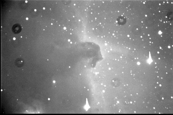 Example image showing dust rings. The dust rings appear as dark circular ring shapes on the image.