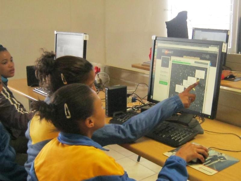 Grade 8 students from Roggeveld primary school in Sutherland, South Africa, using the LCO resource Agent Exoplanet as part of the outreach program from South Africa Astronomical Observatory. Image Credit: LCO.